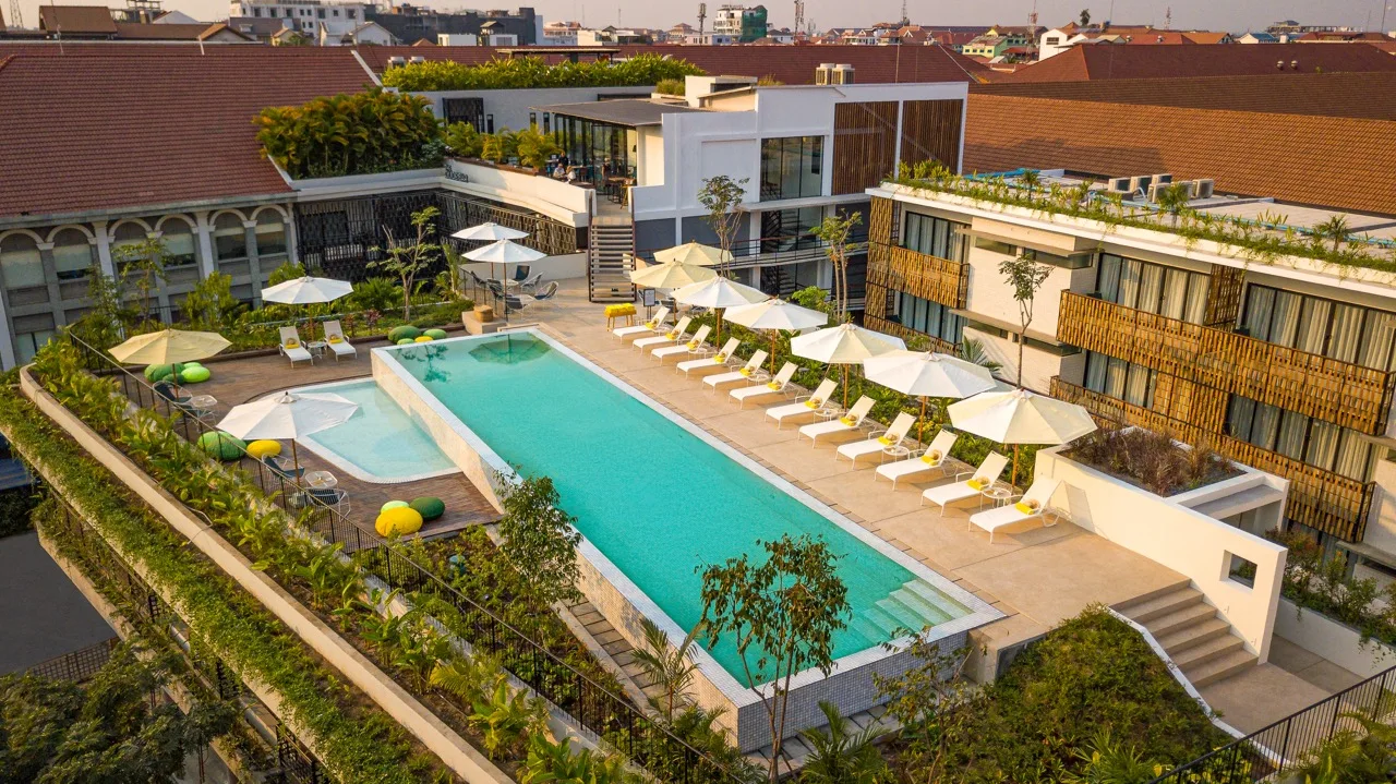 Rooftop swimming pool and sun loungers at The Aviary Hotel